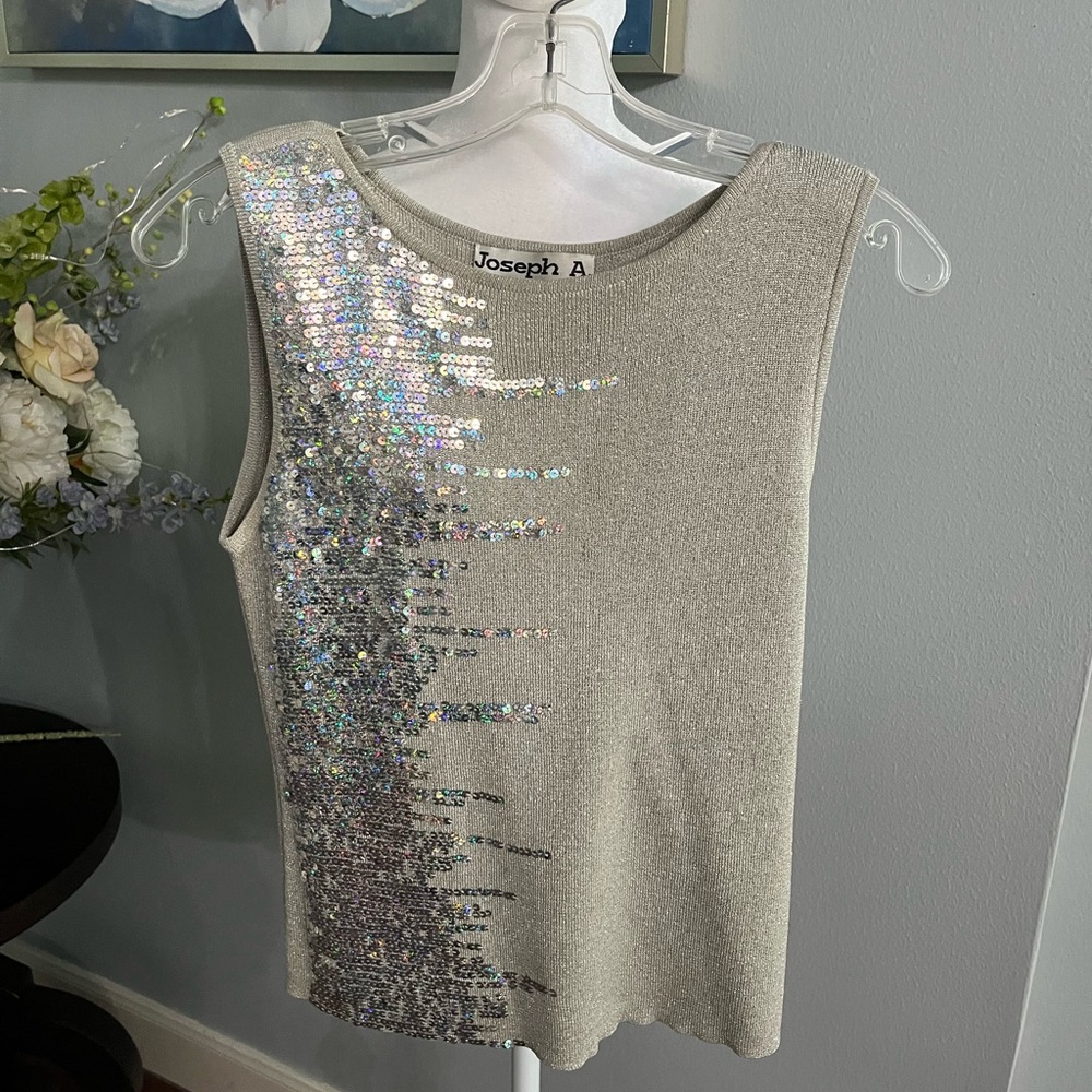 Joseph A medium silver top in good condition.